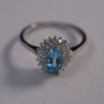 Oval Blue Topaz and Cluster Ring